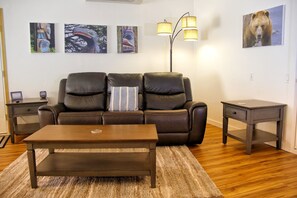 Living Room with leather power recliners, including powered headrests. 