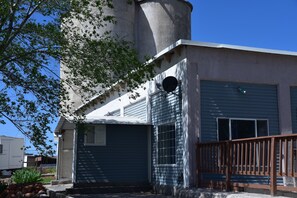 View to South of front entrance and silos