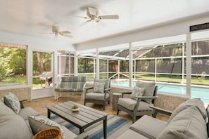 patio has plenty of seating for all, escape the sun, but still see the pool