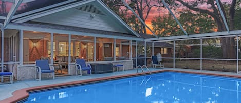 Relax through the warm days of the summer with a screened in, private pool 