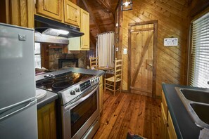 The studio cabin space also features a fully equipped kitchen