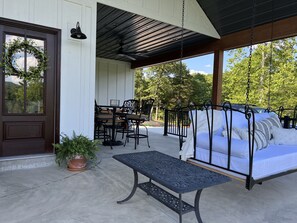 Eating area, lounging with fire pit, poarch swing.