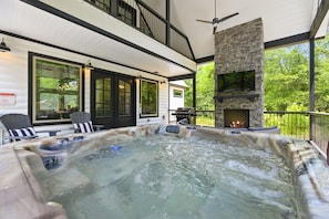" Unwind in our outdoor hot tub, surrounded by the serene sounds of nature. A magical spot to relax muscles after a day of adventure "