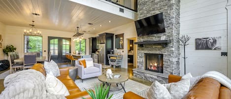 " Kick back by the fire in a plush leather sectional as the vaulted ceilings of our Cozy White Cabin loft high above "