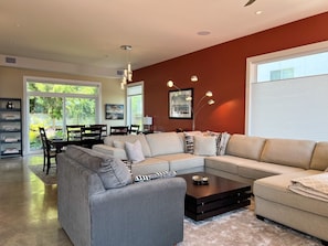 Main level living room. The grey chair folds out into a twin bed.