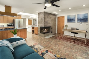 Second living room also features a gas fireplace and open access to the kitchen