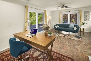  Second living room with sofa, large desk and access to wrap around deck