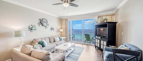 Living room offers ample, comfortable seating with breathtaking views of the Gulf of Mexico.