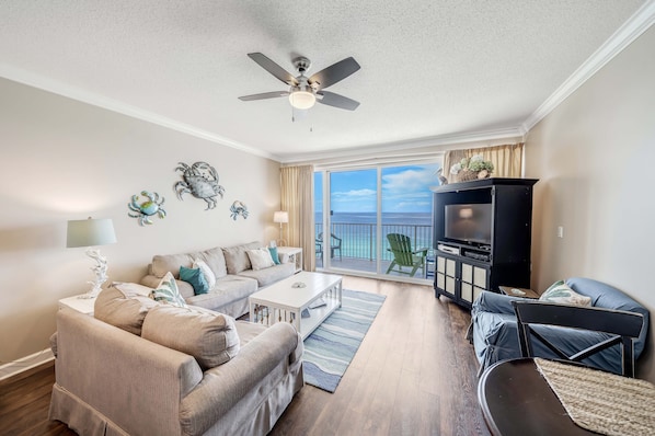 Living room offers ample, comfortable seating with breathtaking views of the Gulf of Mexico.