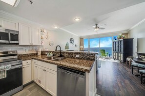 The fully equipped kitchen features stainless-steel appliances, granite countertops, and has everything you need to prepare meals for family & friends.