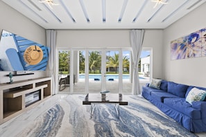Spacious Living Room with an 85" TV . You can enjoy the best movies ,series .