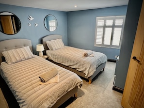 Twin bedroom room top of the town house with views over Cheltenham’s skyline