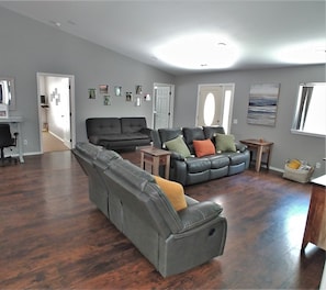 Spacious living room with Smart TV and queen futon for extra sleeping space