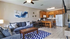 Walk into newly updated living room with brand new couches, open concept living!