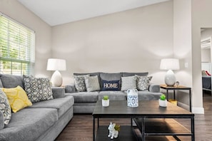 Plush loveseat and sofa make for cozy gatherings.