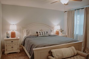 Bedroom 1 - King Bed. Has a backyard pool view, private bath and walk-in closet.