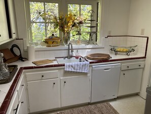White country kitchen with skylight.