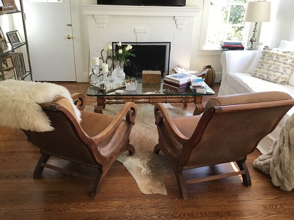 Living Room w/ white Pottery Barn Sofa, 65" Samsung Smart TV & Leather Armchairs