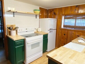 The kitchenette has ample supplies to prepare all your meals.