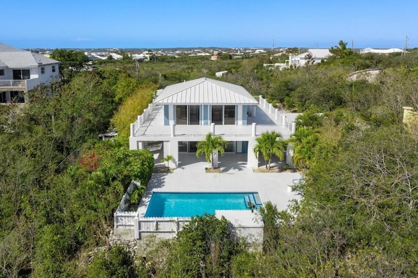 Aerial view of pool deck and outdoor patio space 