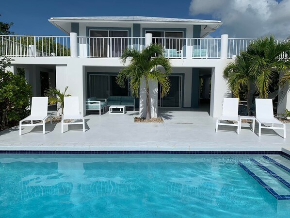 Pool deck - pool loungers and conversation sets