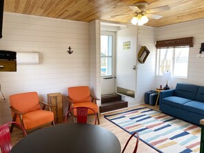 This newly renovated cabin offers all new furniture, new flooring, paint, decor, and shiplap walls!