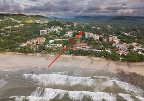 Great beach for swimming and surfing! The arrow shows our condo