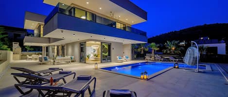 Night view at the villa and pool side.