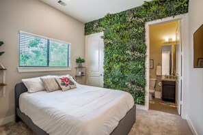 Enjoy your own garden wall in this spectacular room, with partial city views. 