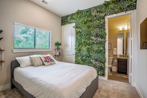 Enjoy your own garden wall in this spectacular room, with partial city views.