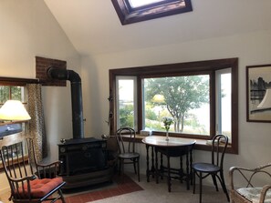 The living room has a beautiful ocean view, plus a fireplace and skylight.