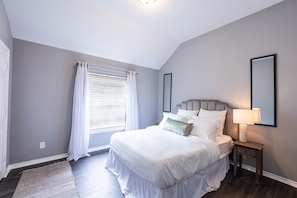 Relax and recharge in this spacious room with a luxurious queen-size bed