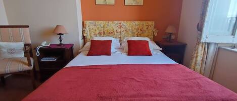 This comfy room features a double bed.