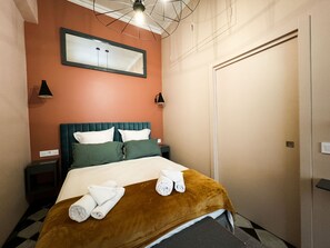 Another view of the stylish bedroom with elegant decor and soft lighting, ensuring a comfortable and relaxing stay.
