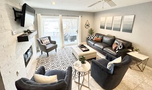 Upstairs living room with lake view - fire place & smart tv