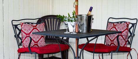 Covered patio with comfortable seating to relax outdoors!