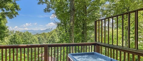 Mountain View Chalet's bubbling hot tub with views