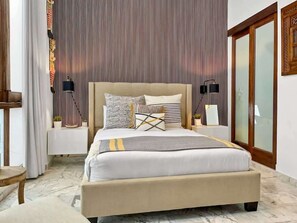The master bedroom has a queen bed, smart TV, ensuite bathroom, blackout curtains and full closet.