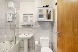 Bathroom with bath and shower