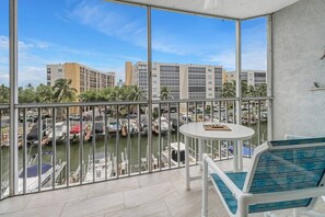 The 2-story condo has 2 fully screened balconies that enjoy views of the boat docks along the Gulf access canal.