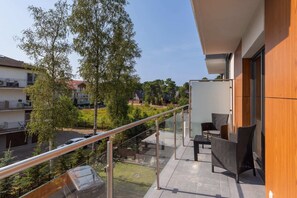 The balcony provides a perfect spot for enjoying the fresh air. 