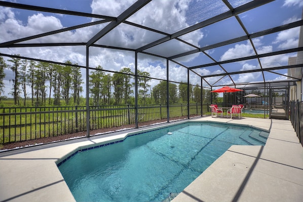 Swimming pool and fenced backyard 