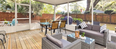 Newly constructed screened-in back patio  with fan, outdoor dining and lounge