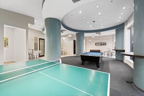 Get ready for fun and friendly competition in the game room, featuring a soccer table, pool table, and ping pong table. Just steps away from the stunning Hollywood Beach, it’s the perfect place to unwind after a day in the sun.