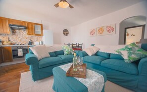 Living room, dining area and kitchen