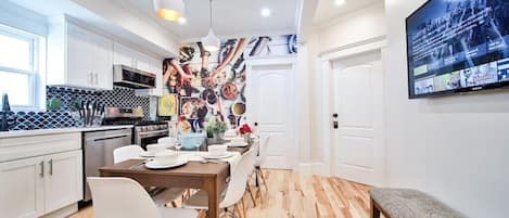 You will love gathering and eat in this space featuring a stunning wall art,Tv.