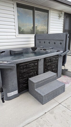 Step outside and enjoy the hot tub just a few steps from the back door in our expansive back yard.