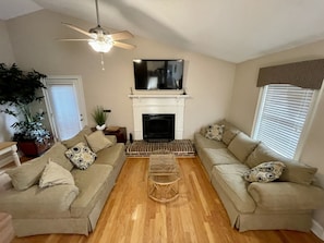 Living room with 60 inch Roku Smart TV