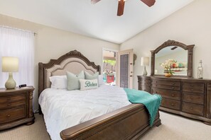 Retreat to the romantic master bedroom to find private access to backyard pool.