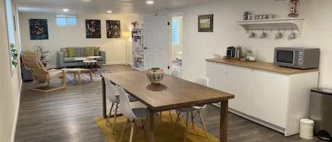 Living and dining spaces with the kitchenette to the right